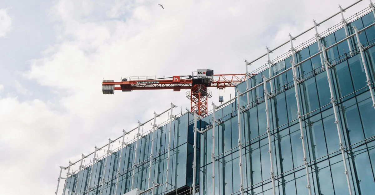 Glass building with crane